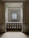 An elegant space with marble walls and a decorative balustrade. A window with a grid design is centered in the background, allowing soft light to enter the room, creating a calm and serene atmosphere.