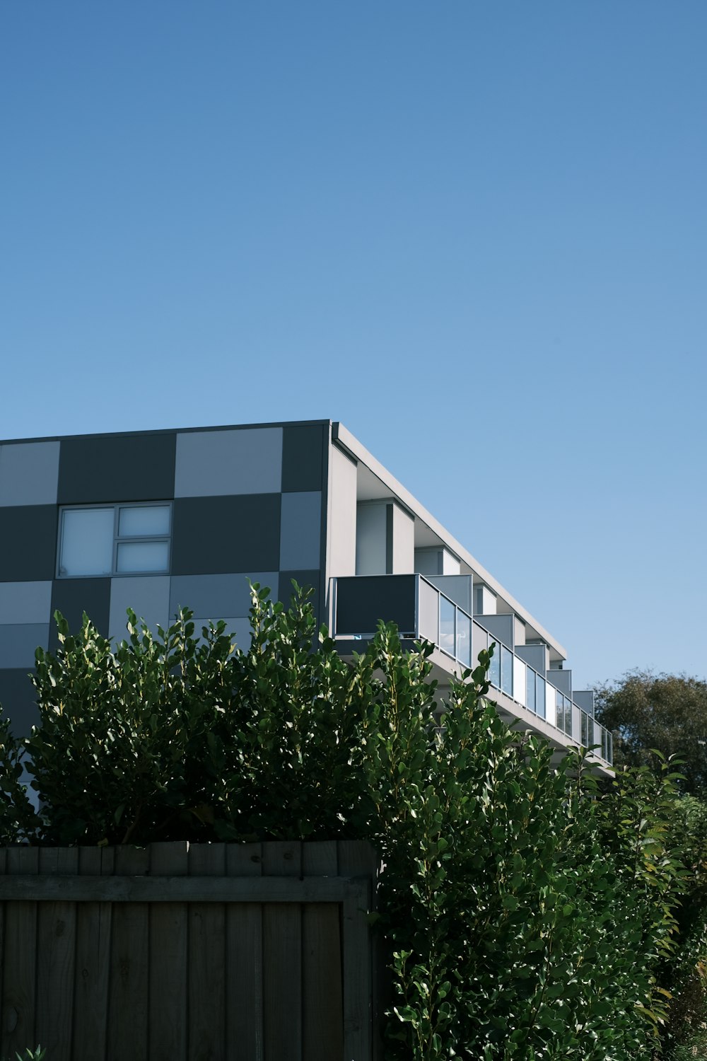 green trees near brown concrete building during daytime