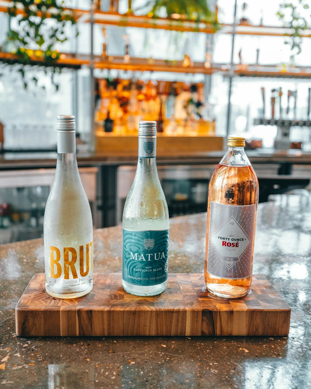 two white labeled bottles on brown wooden table