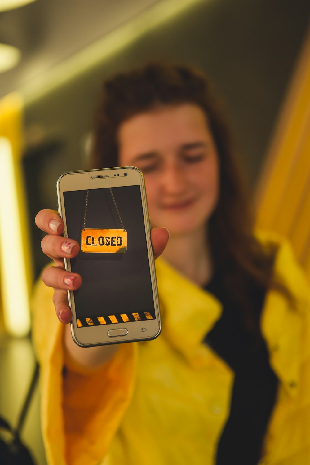 woman holding silver iphone 6