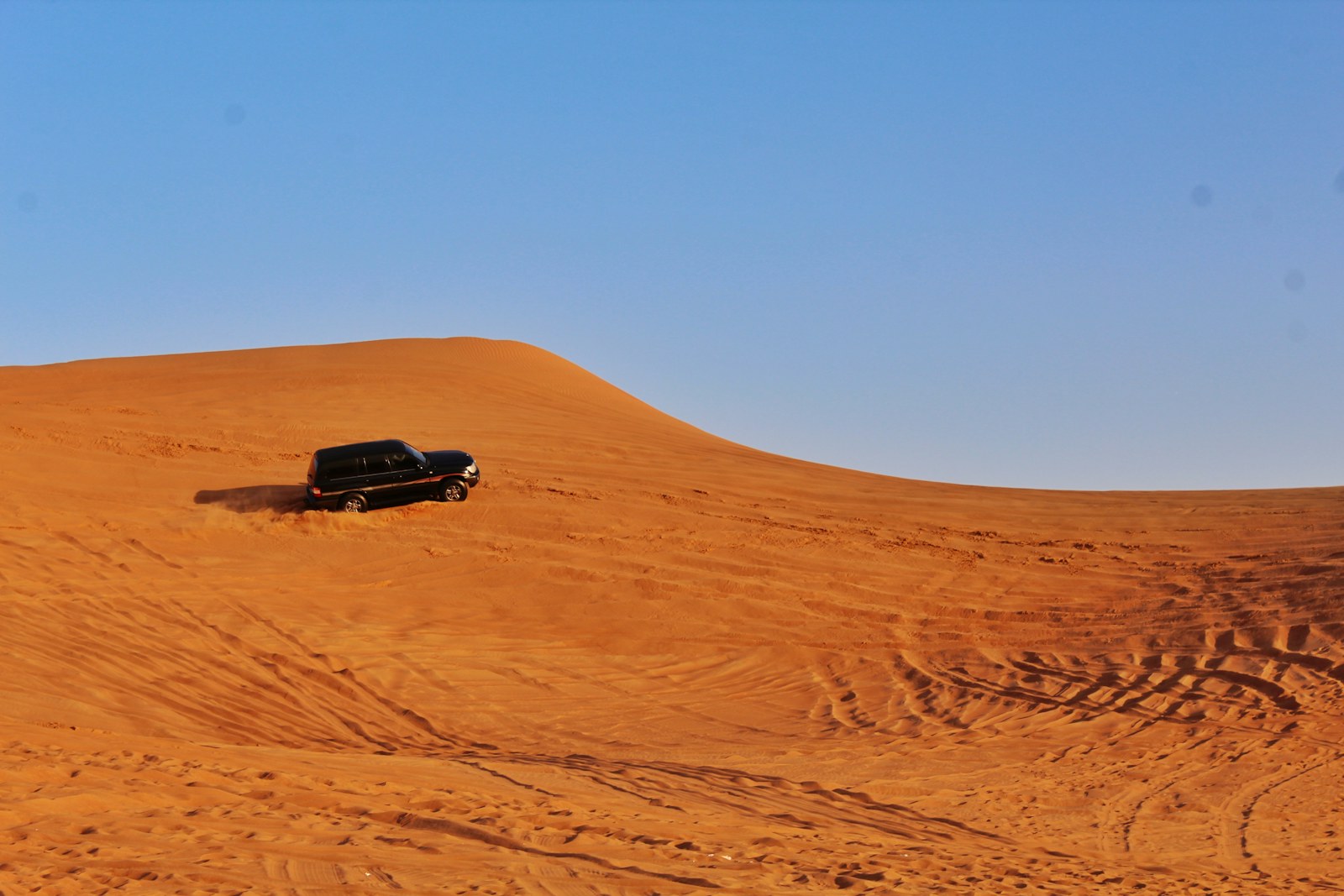 Toyota Land Cruiser Prado parked in the desert