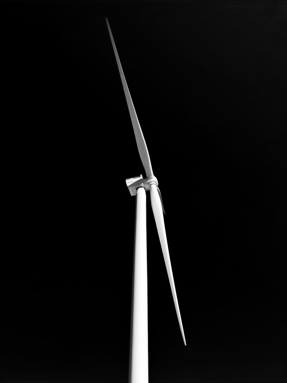 white metal pole with black background