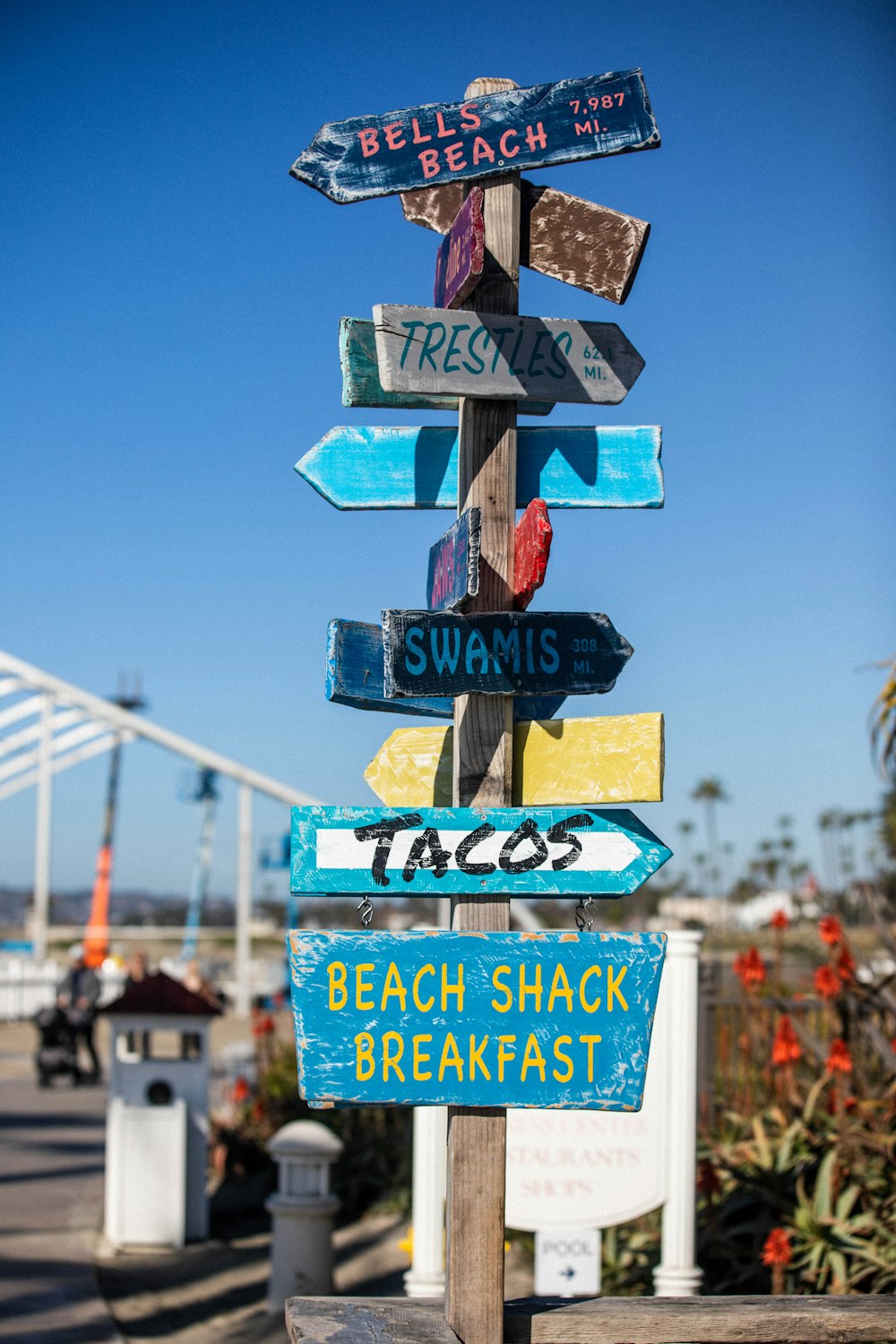 blue and white wooden street sign