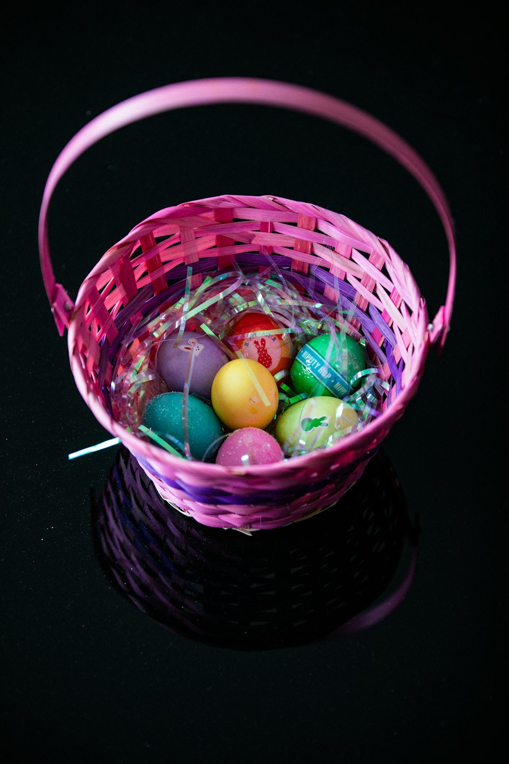 assorted color egg in brown woven basket