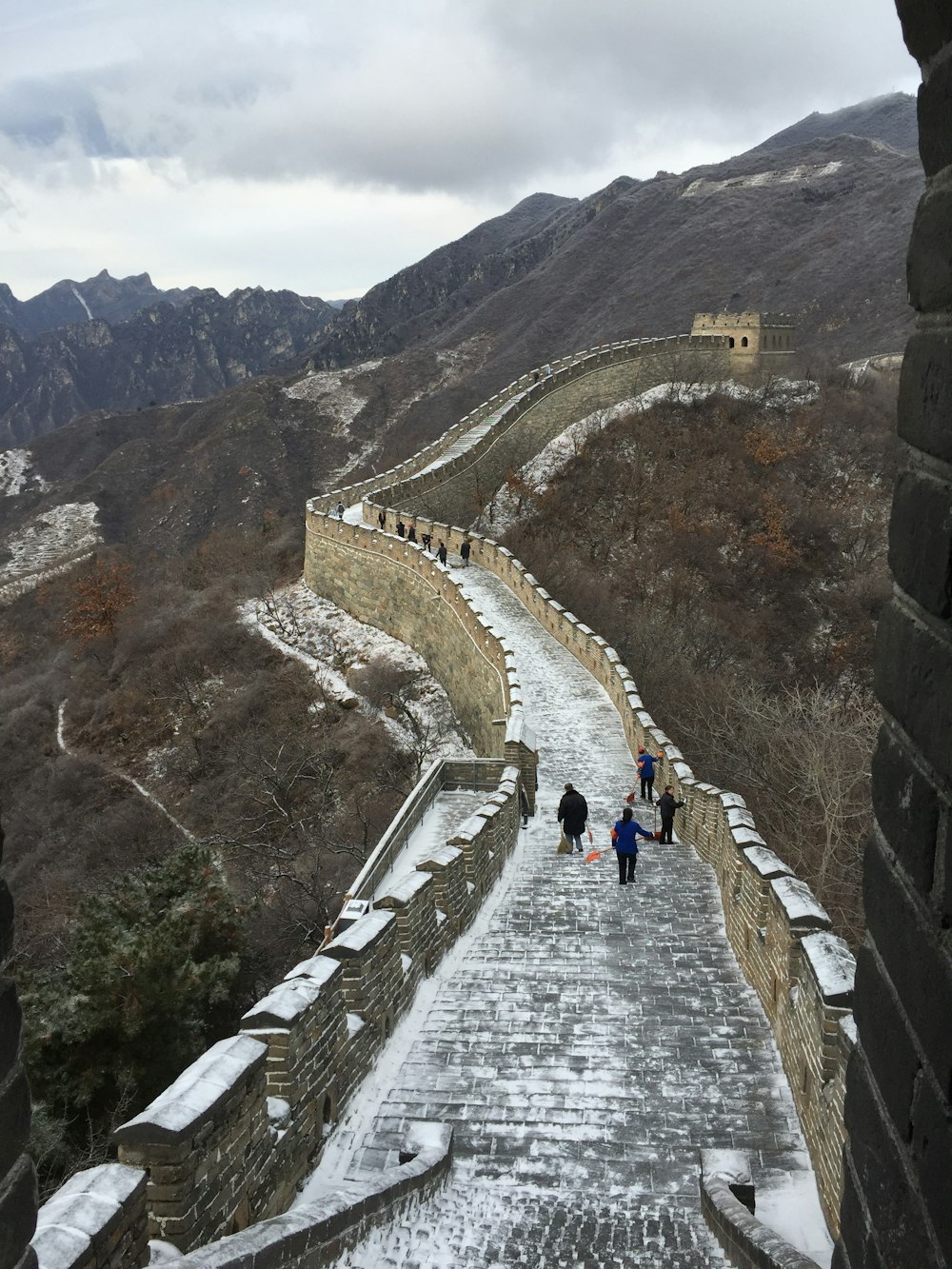 people walking on gray concrete bridge during daytime