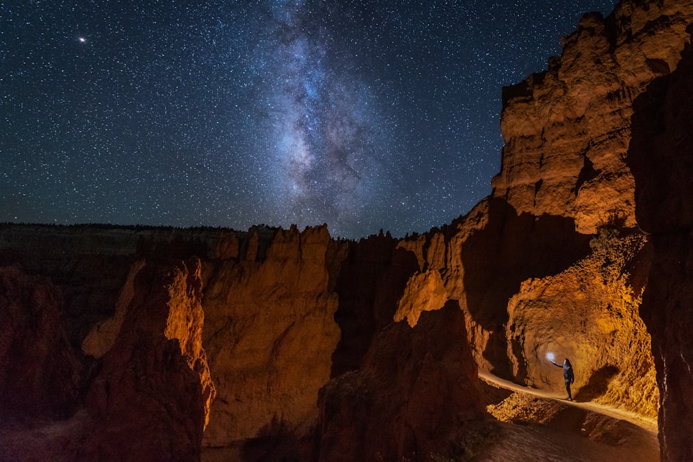 brown rock formation under blue sky during night time