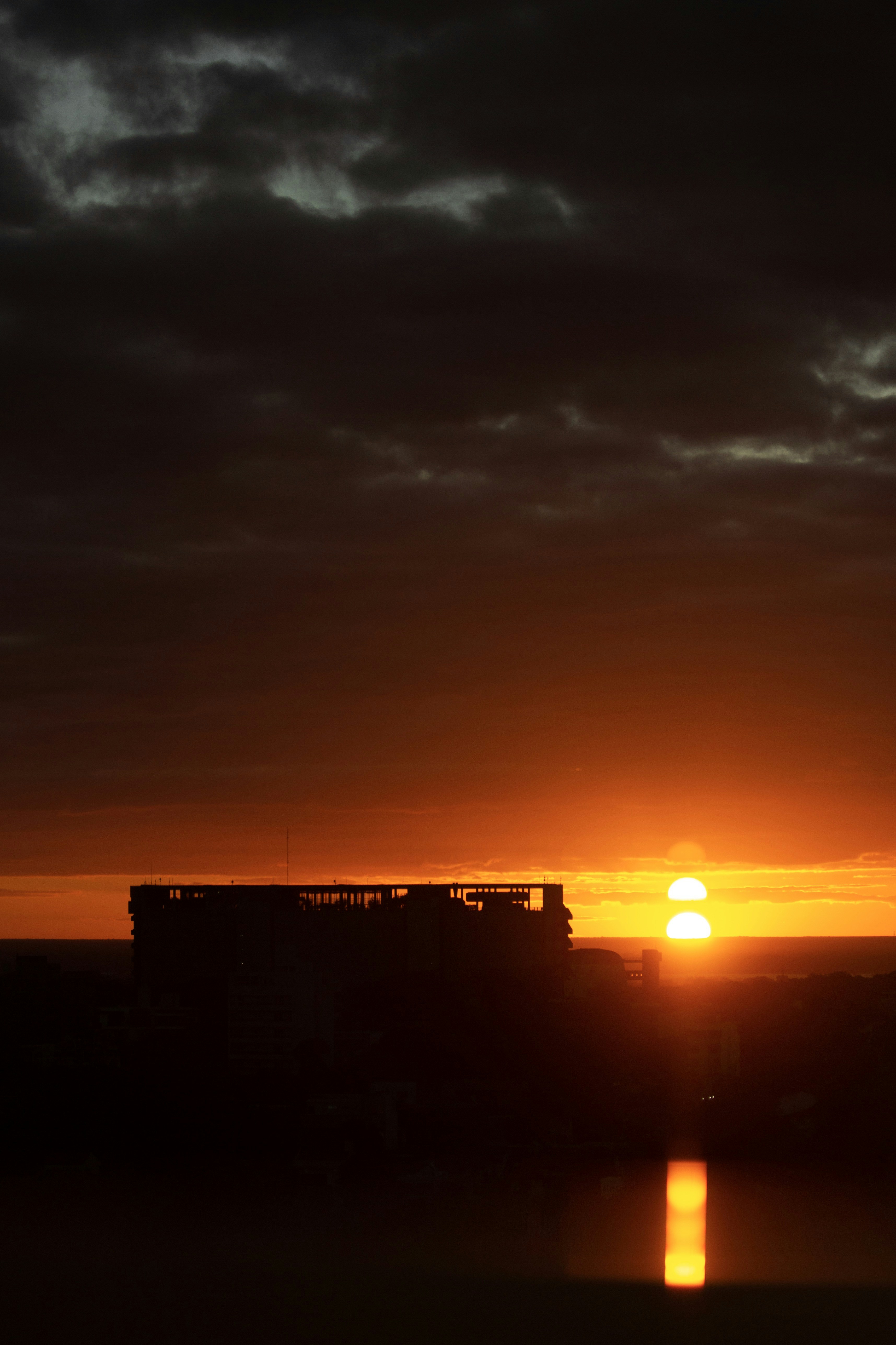 silhouette of building during sunset