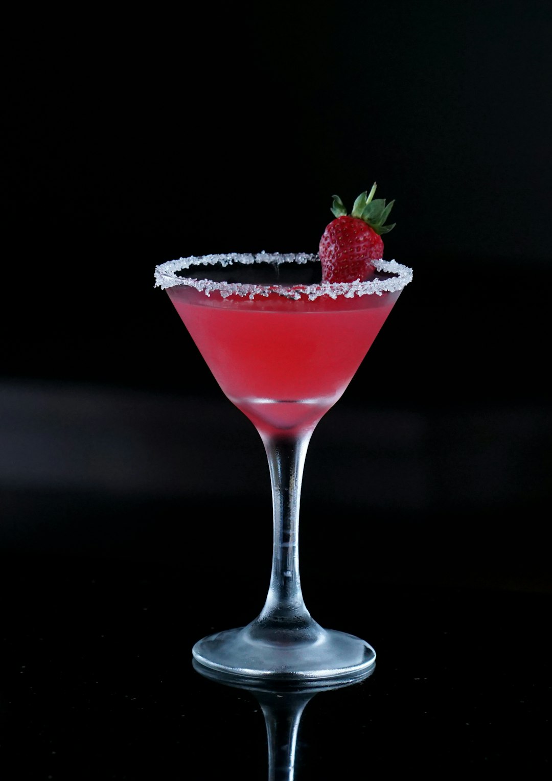 strawberry in clear martini glass