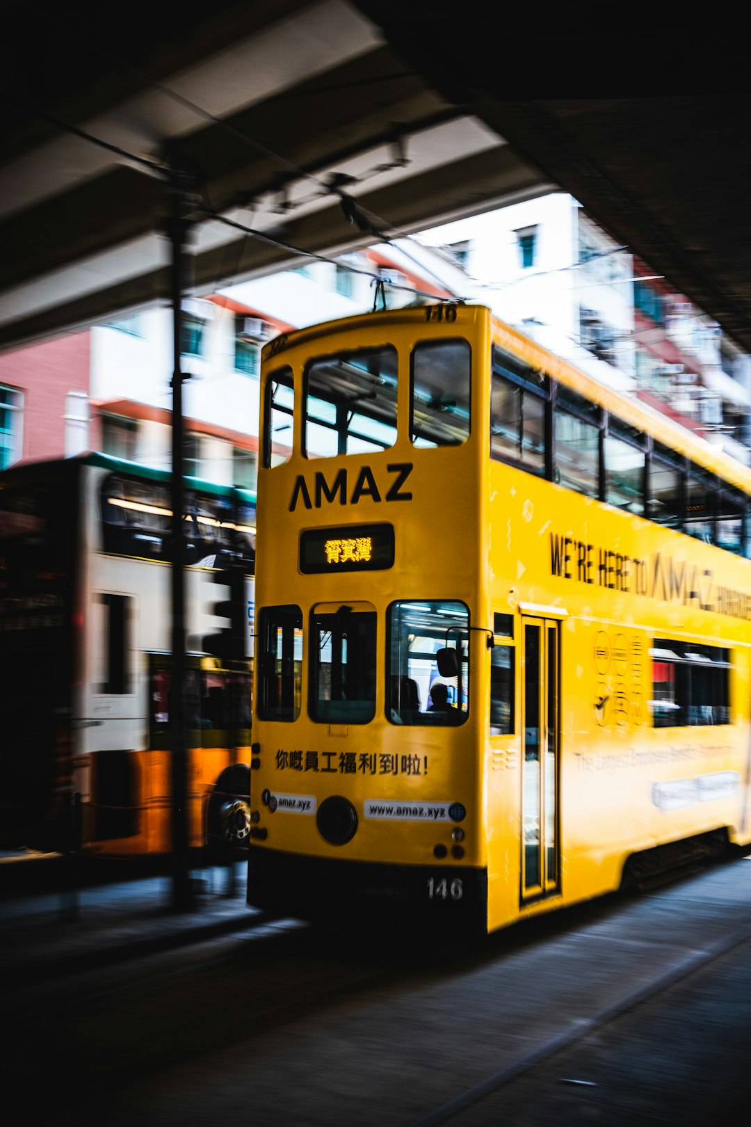 yellow and white bus on road during daytime