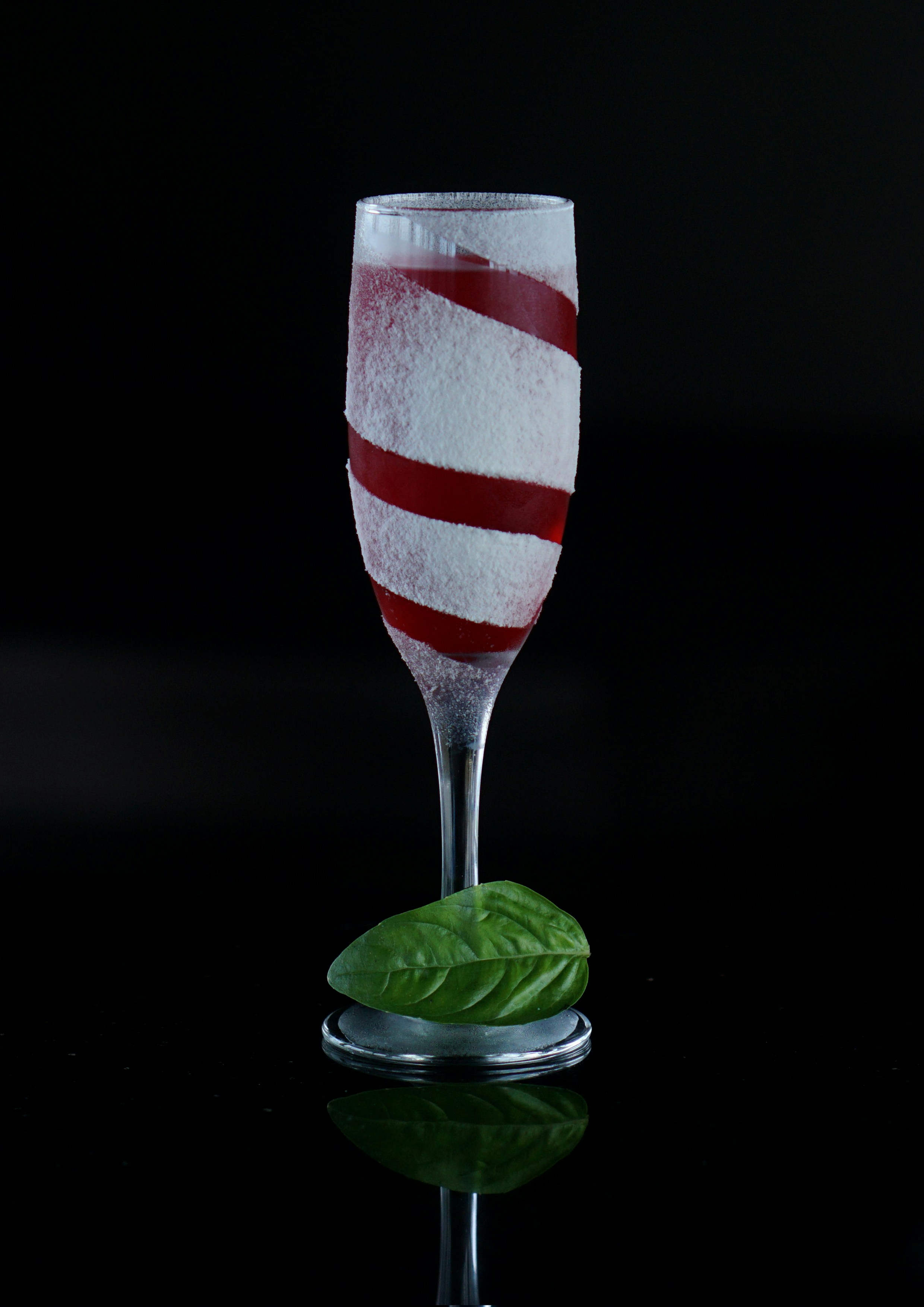 red and white striped wine glass