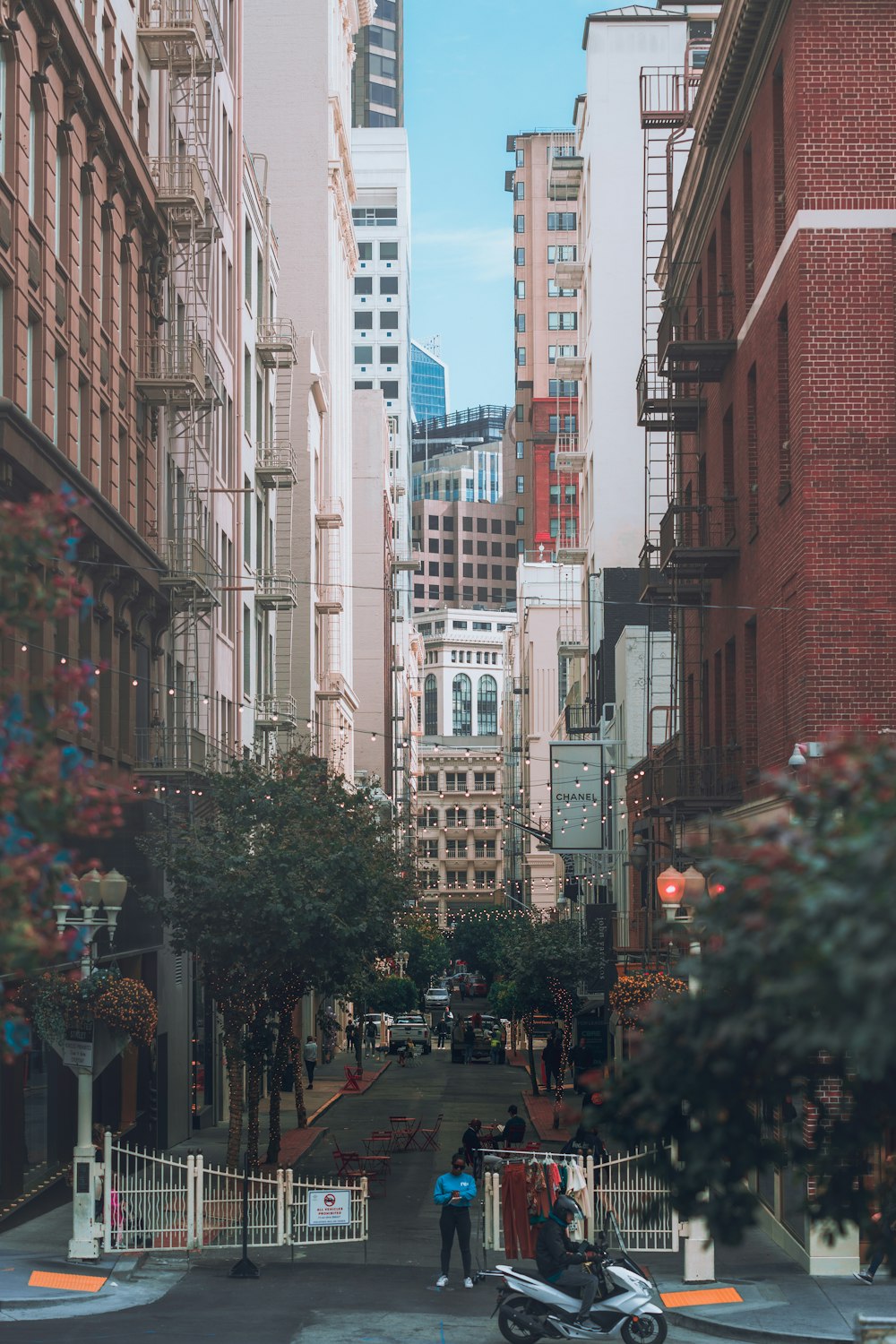 people walking on street near brown concrete building during daytime