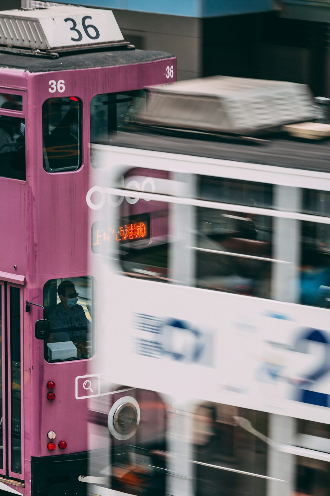 red bus with white and blue sticker