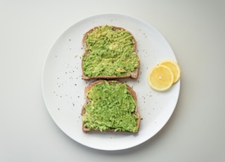 green and brown vegetable on white ceramic plate