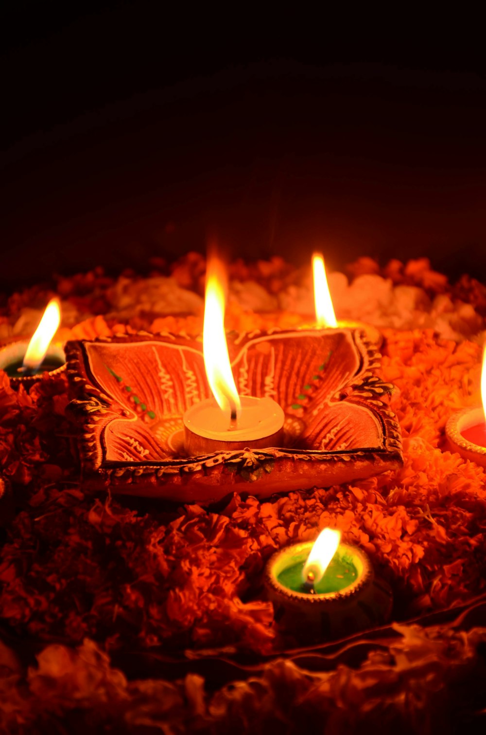 lighted candle on brown wooden table