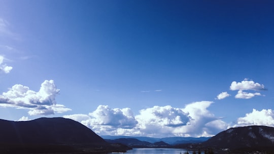 white clouds over mountains during daytime in Salmon Arm Canada