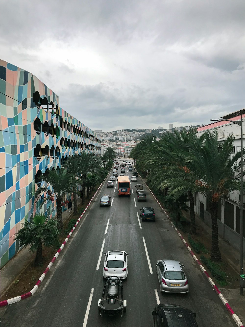 cars parked on side of road near building during daytime