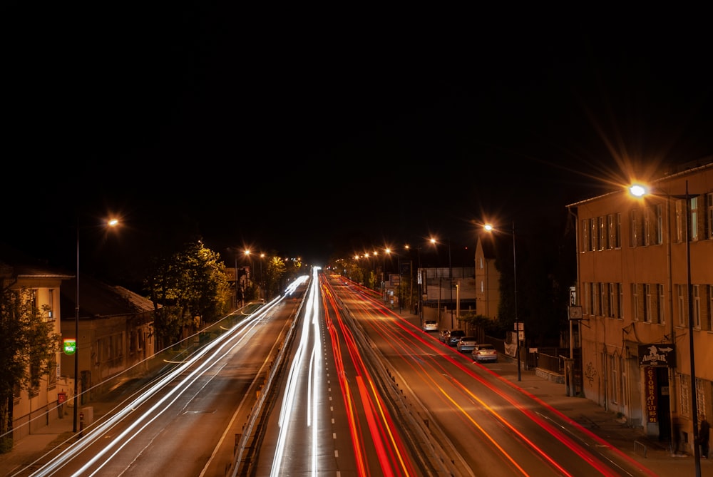 time lapse photography of cars on road during night time