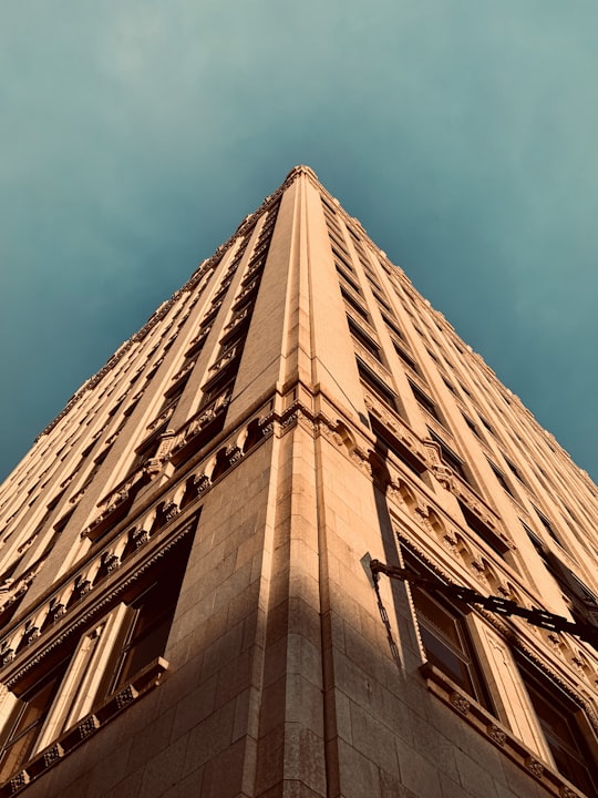 brown concrete building under blue sky during daytime in Downtown United States