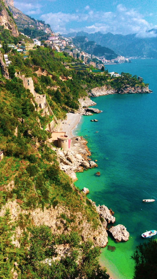 aerial view of green trees and body of water during daytime in Amalfi Coast Italy