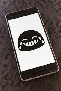 A user laughing while using a meme sound effect on their phone.
