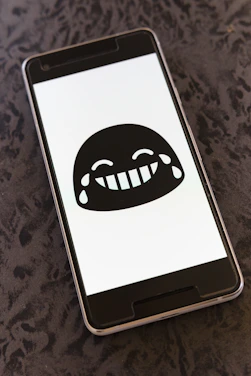 A cozy smartphone screen showing a lively chat on Snapchat with playful emojis.