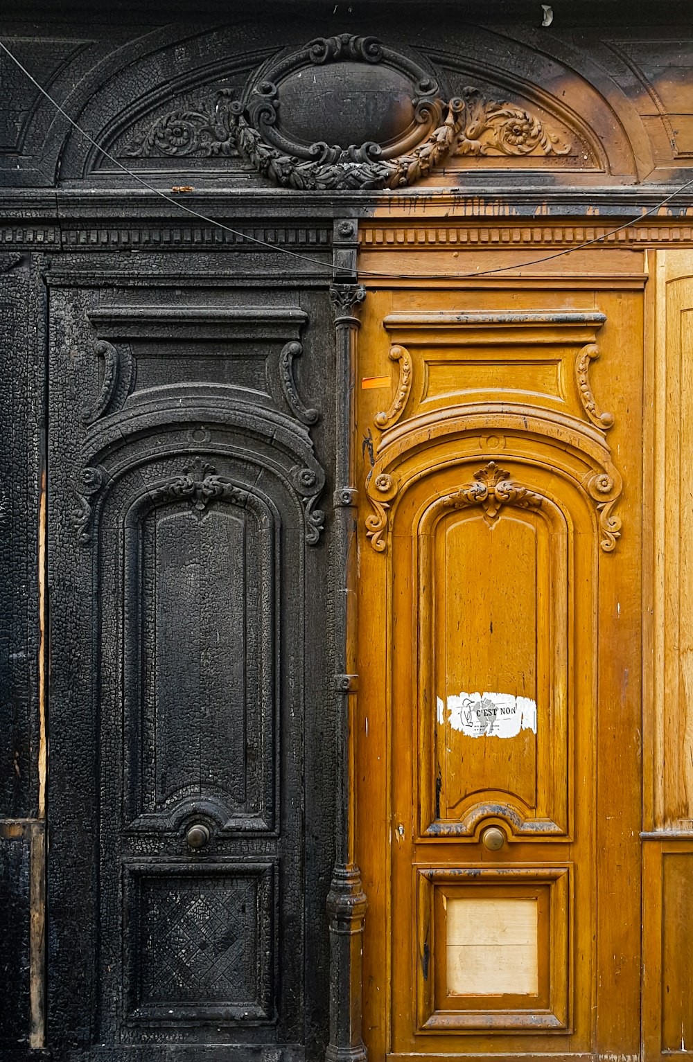 brown wooden door with gold door lever