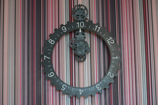 A clock with moving gears representing progress and time passing.