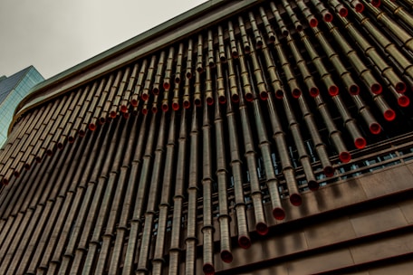 Close-up of high-quality Riifo AC pipes being installed with protective covering in a commercial building.