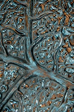 Close-up of macro textures resembling neural pathways in obsidian and gold.