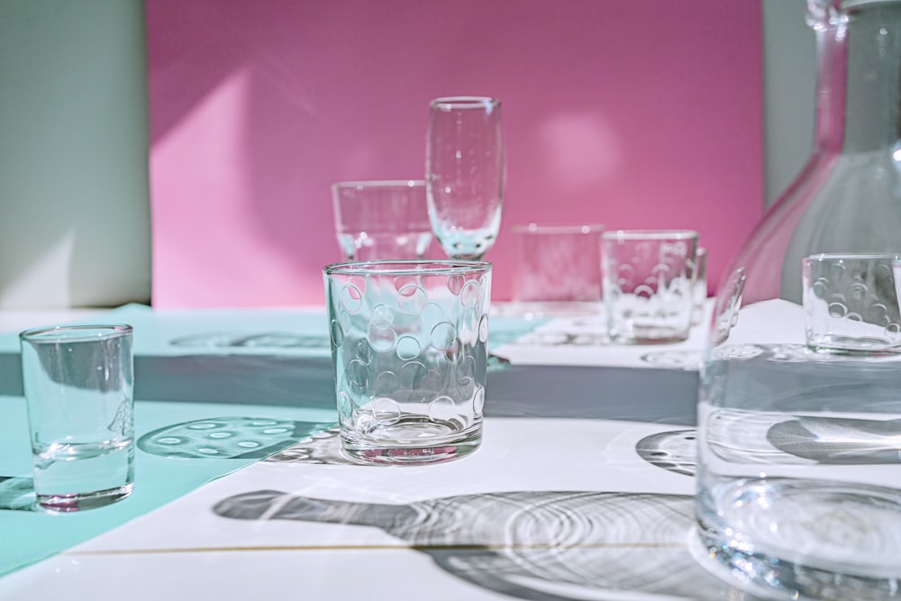 clear drinking glass on white table cloth