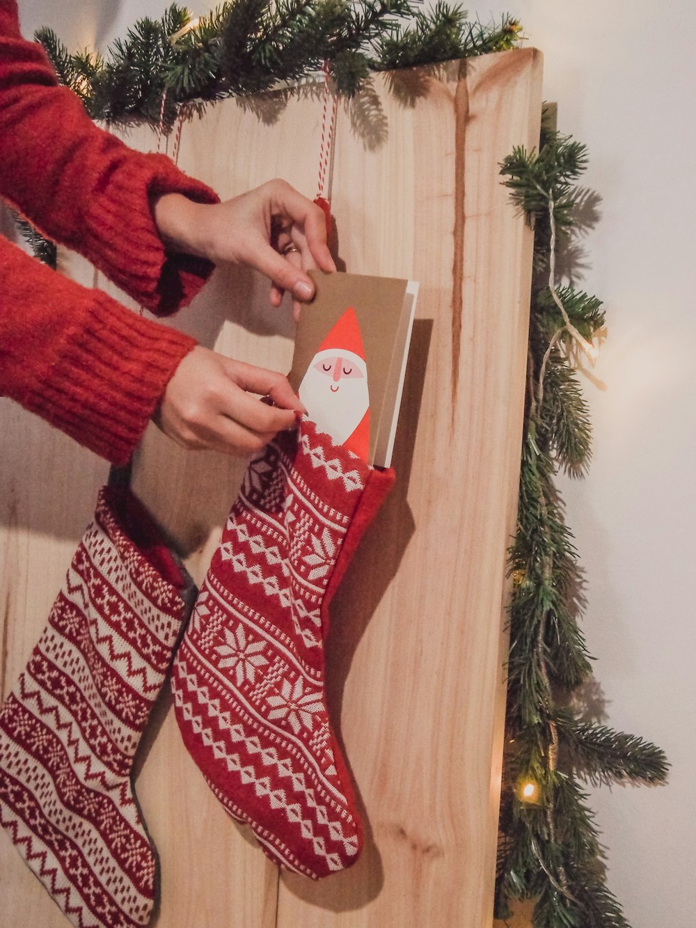 person in red and white sweater standing on weighing scale