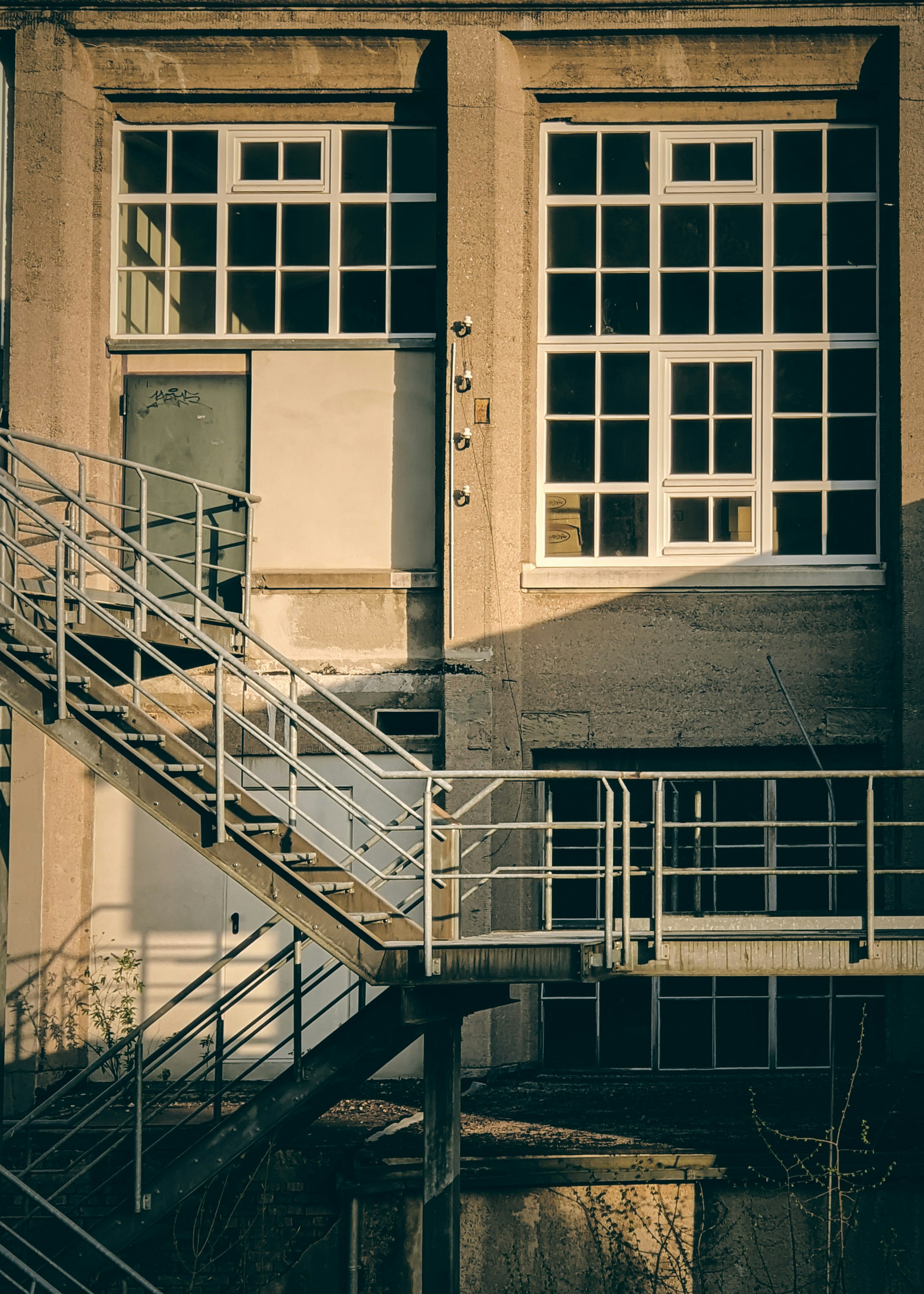 black metal staircase on brown concrete building