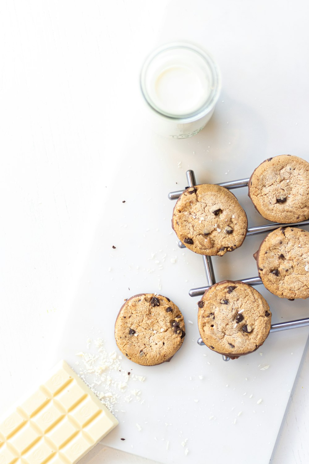 two brown cookies on white table