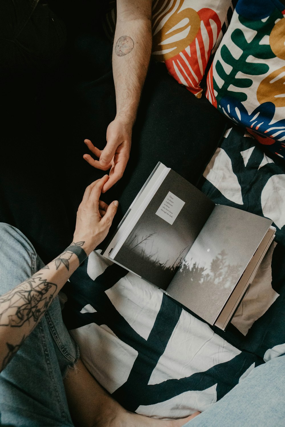 person holding black and white book