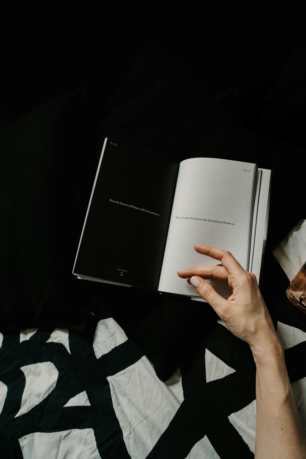 person holding white book page