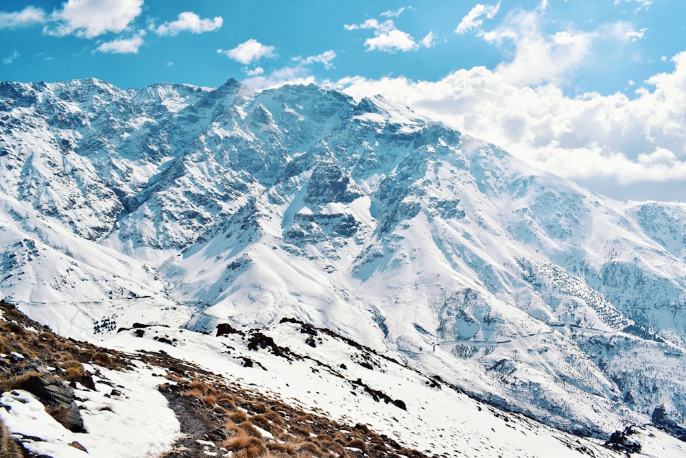 snow covered mountain under blue sky during daytime