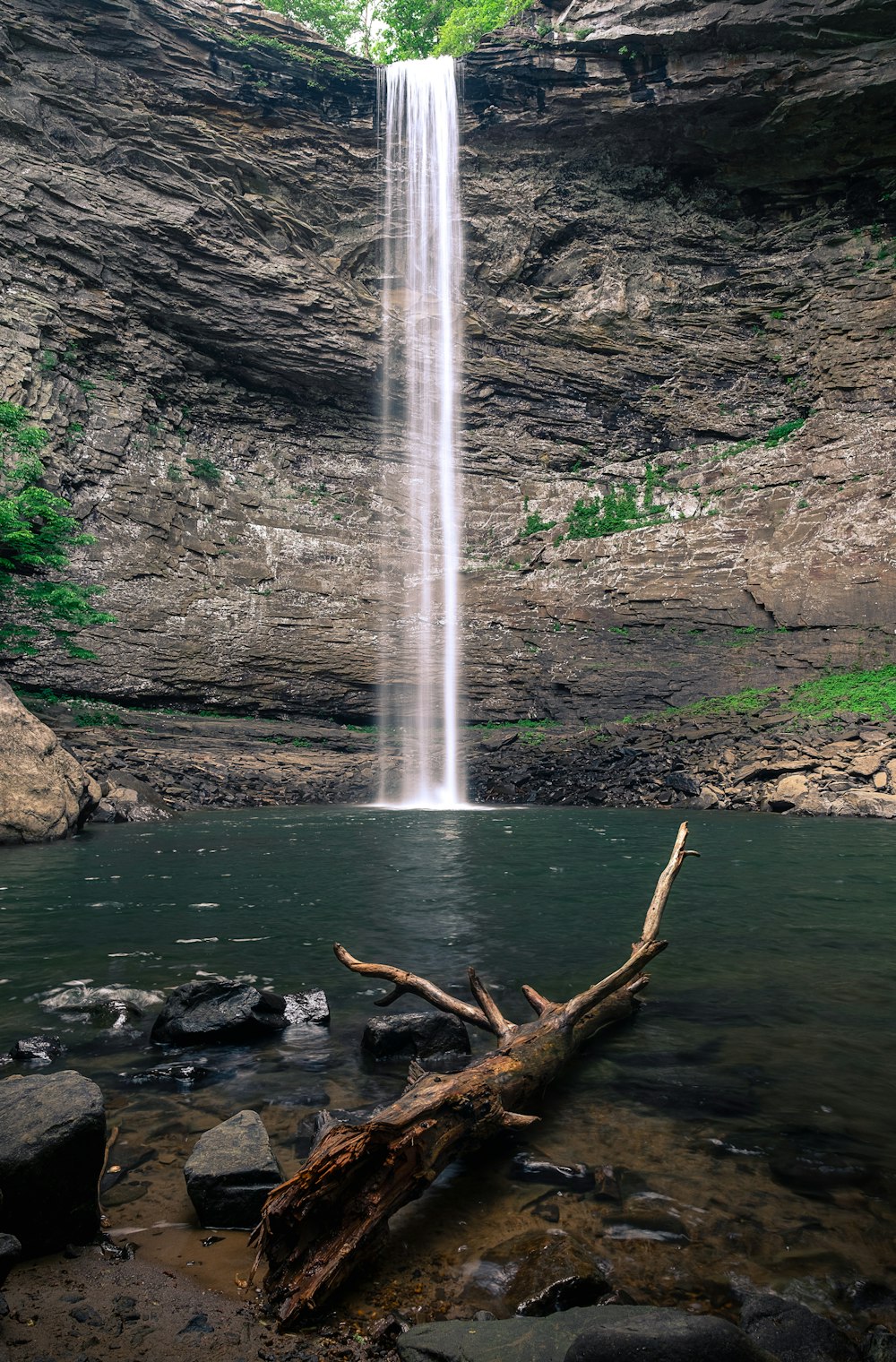 waterfalls on rocky mountain during daytime