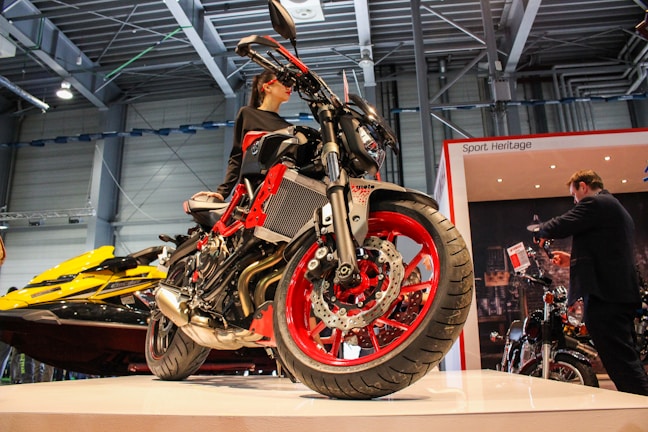 Display of iconic motorcycle oil brands like Liqui Moly and Pirelli at an expo.