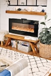 black flat screen tv turned on on brown wooden tv hutch