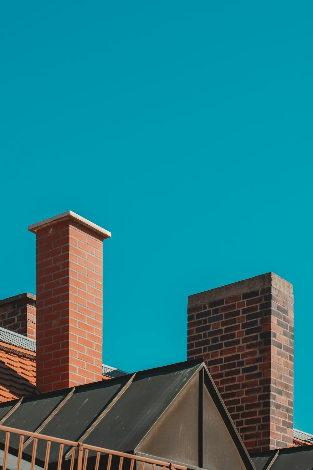 brown brick building under blue sky during daytime