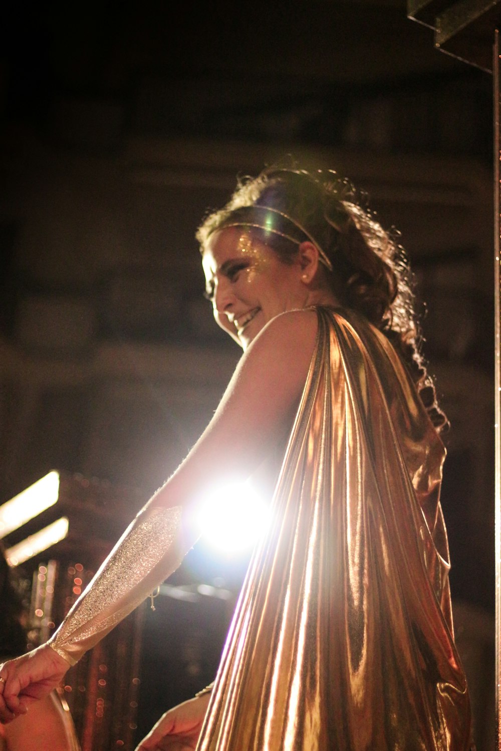 woman in white tank top holding light