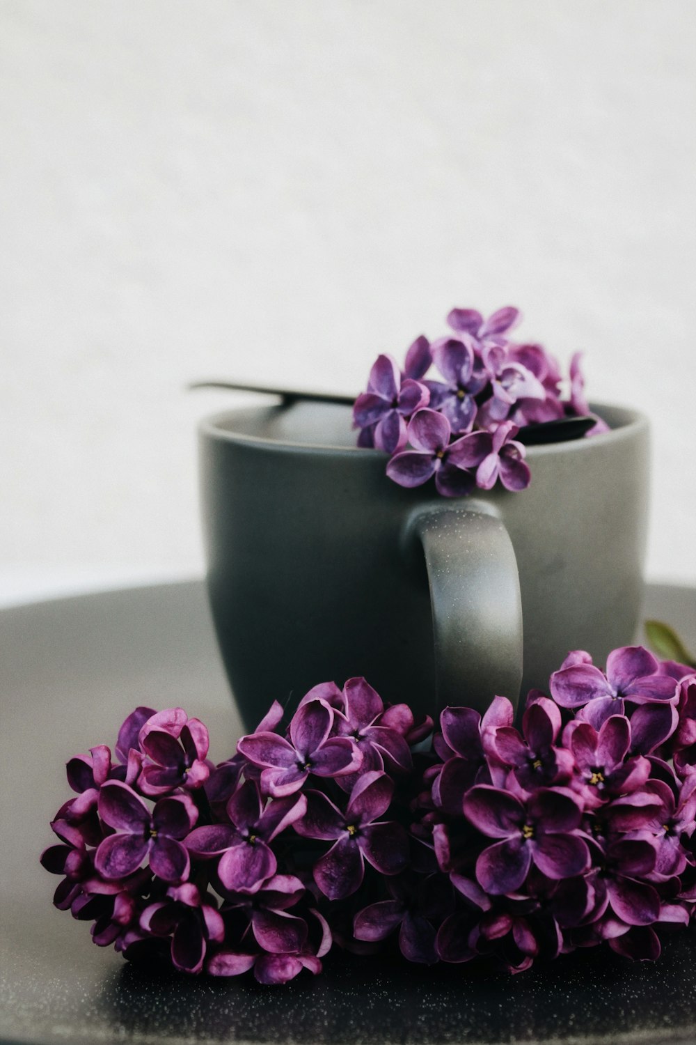 pink flower on green ceramic mug