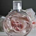 clear glass perfume bottle with pink liquid