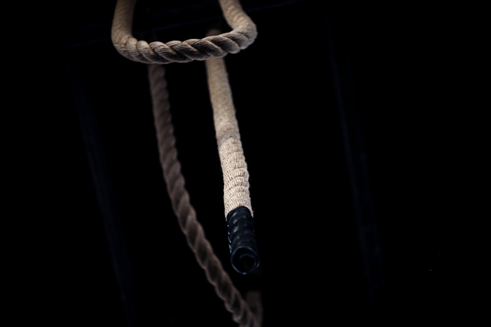 brown rope tied on black background
