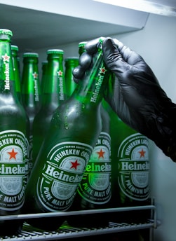 heineken beer bottles on white table