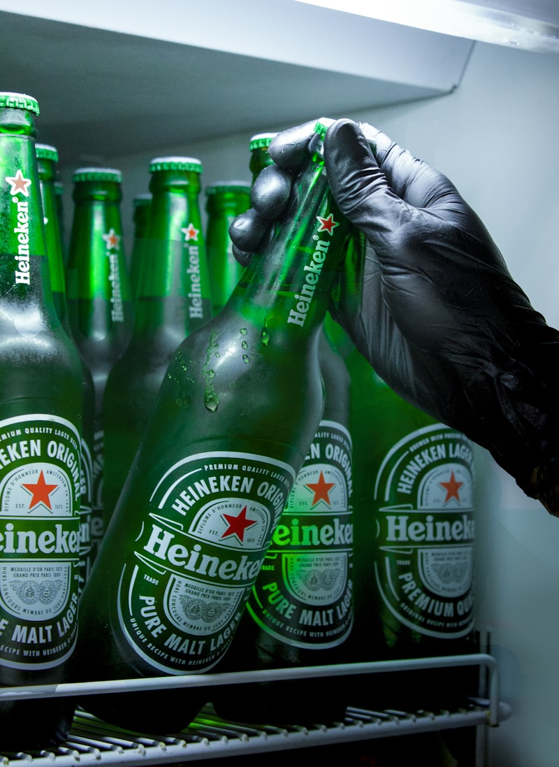 Heineken beer bottles, brewery factory, corporate office building, business meeting, beer production line
