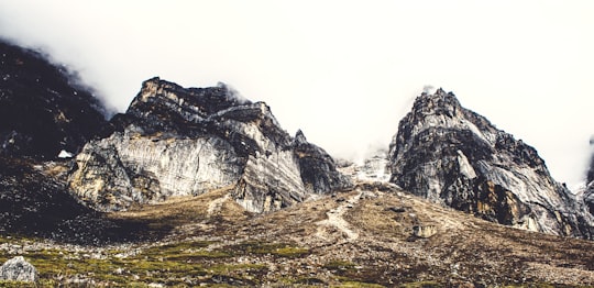 gray rocky mountain under white sky during daytime in Sikkim India