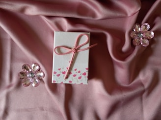 pink ribbon on pink textile