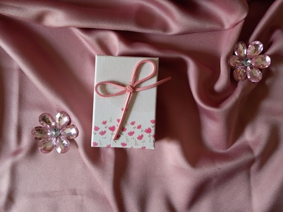 pink ribbon on pink textile