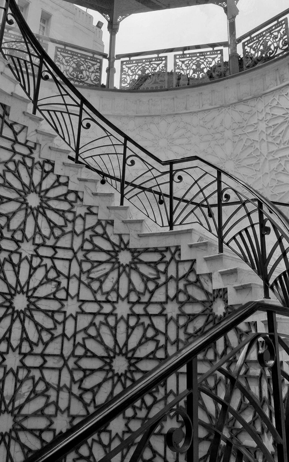 white and black floral spiral staircase